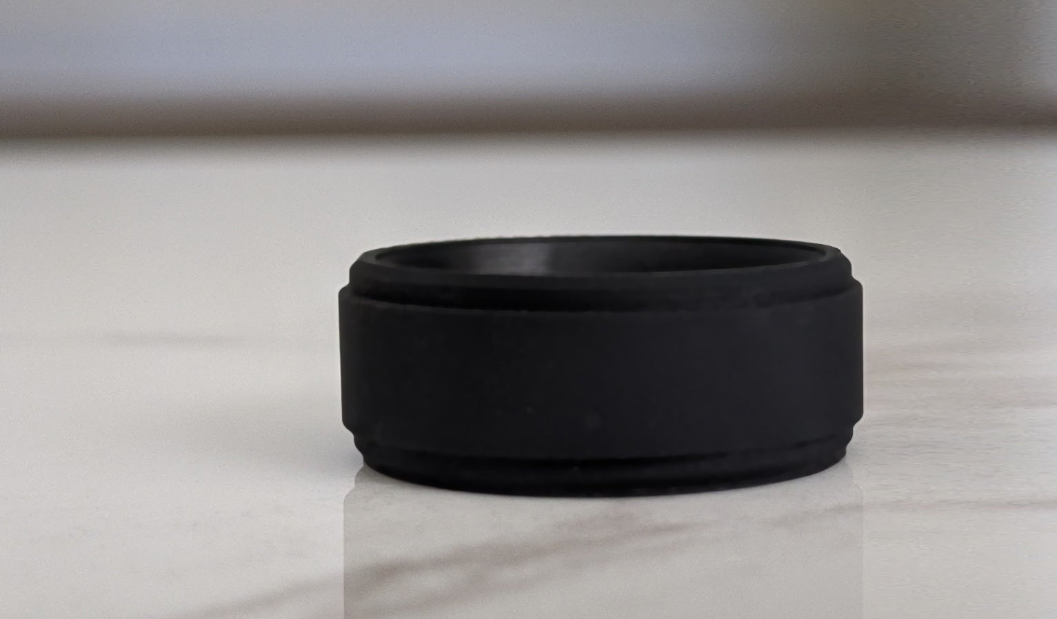 What does it mean when a man wears a black rubber wedding ring?